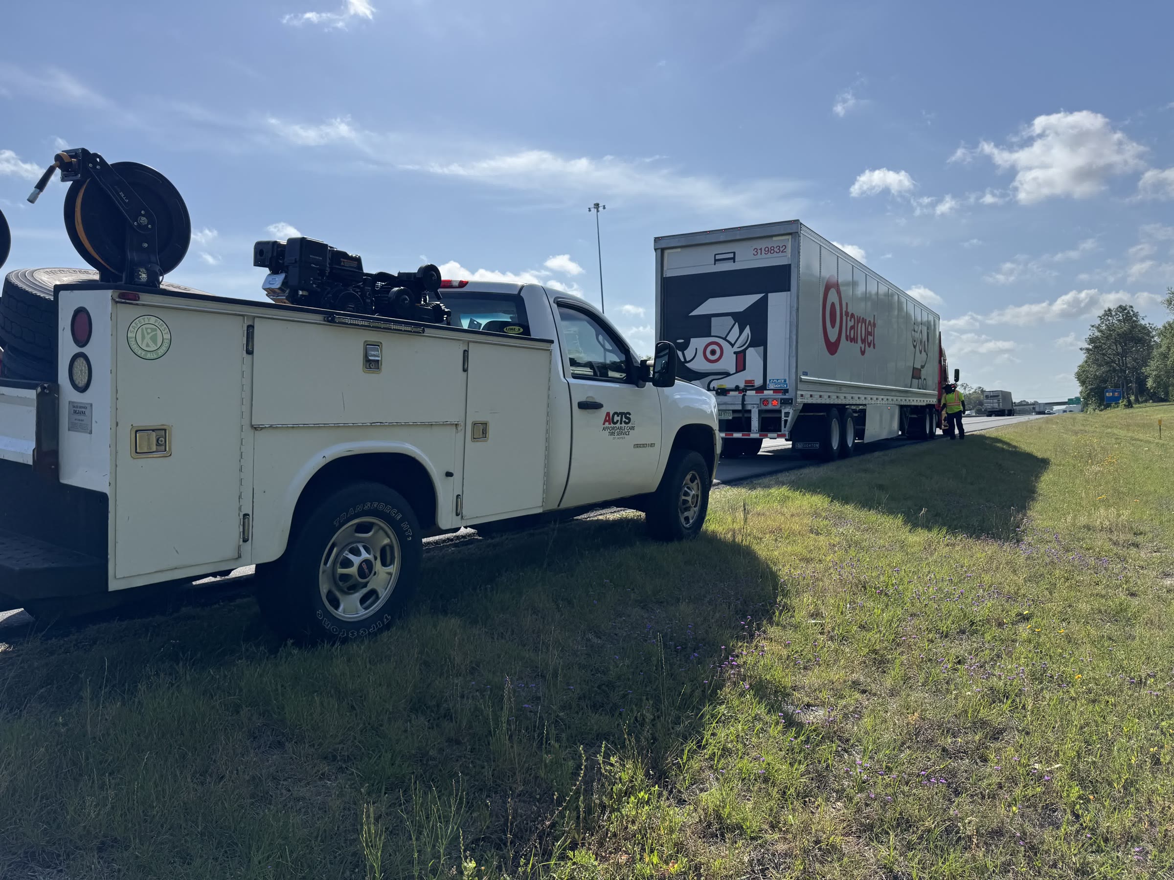 Affordable Care Tire Service truck on a roadside call for a commercial semi on I-75